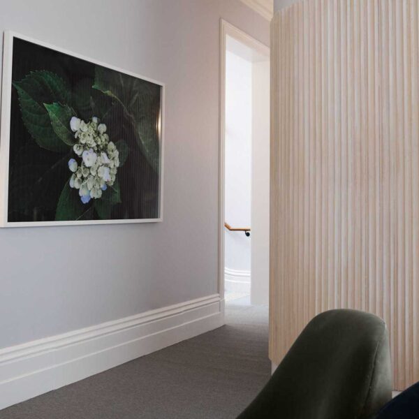 Waiting room hallway with an artwork hanging on the wall