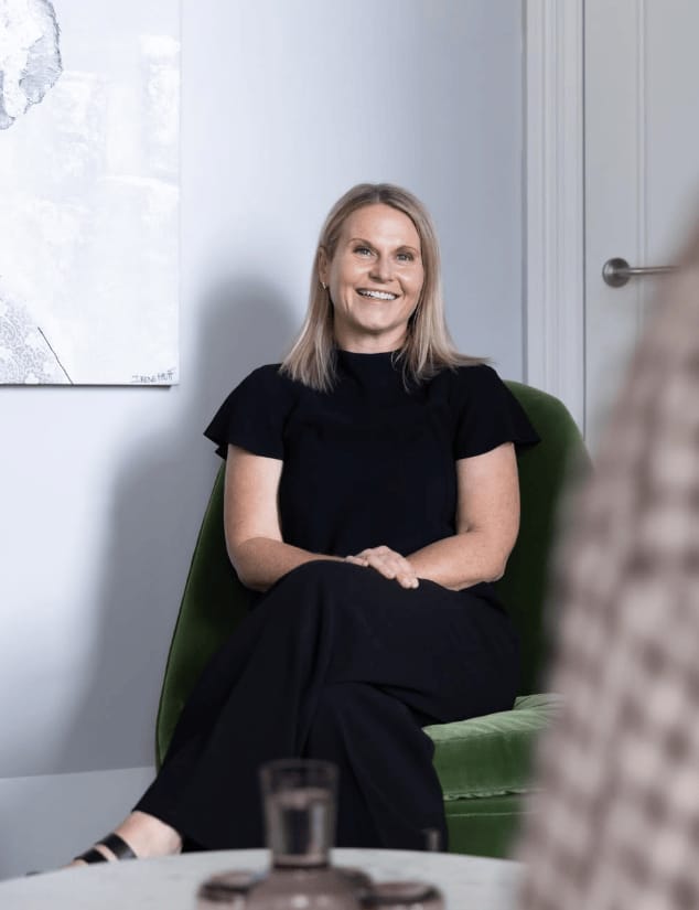 Suellen Peak Senior Fertility Counsellor sitting down on a chair counselling a client