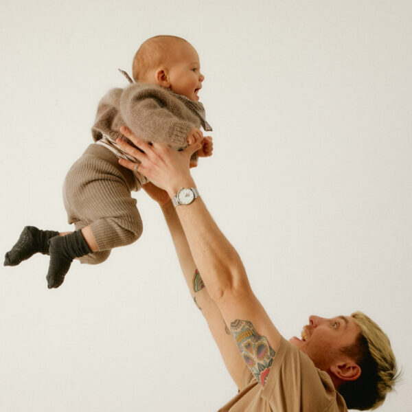 a father playing with a baby