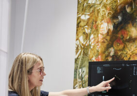 Doctor Rachael Knight sitting down performing ultrasound scan to a client