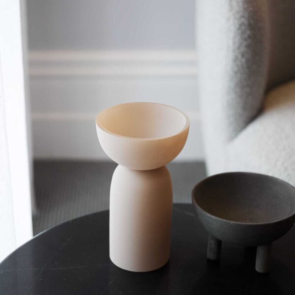 Decorative cup-like objects sitting on top of a side table in a waiting room