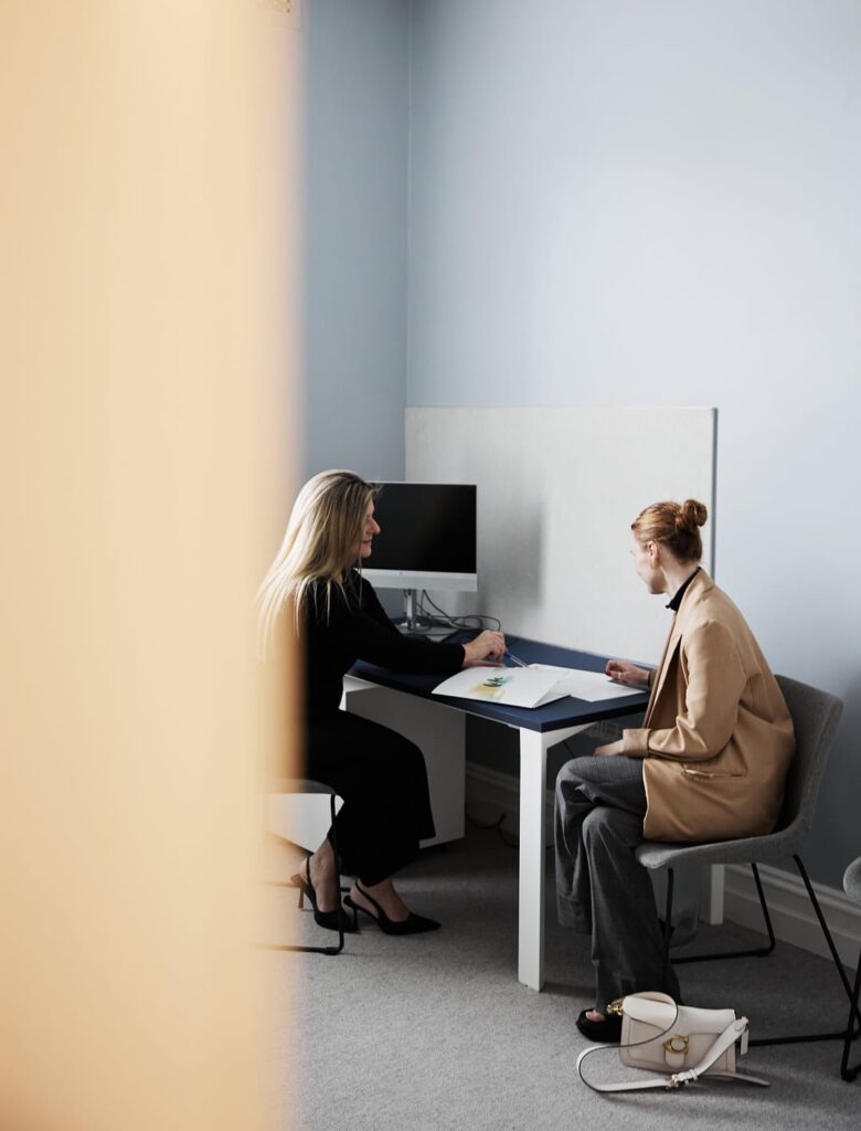 Clinic staff member speaking to a client